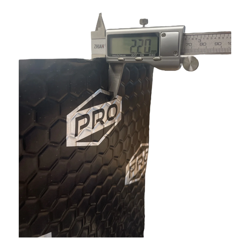 Black sound deadening sheet with a digital caliper showing measurement and 'PRO' branding.