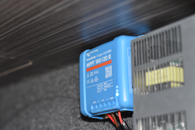 Solar panel controller fitted in camper cupboard