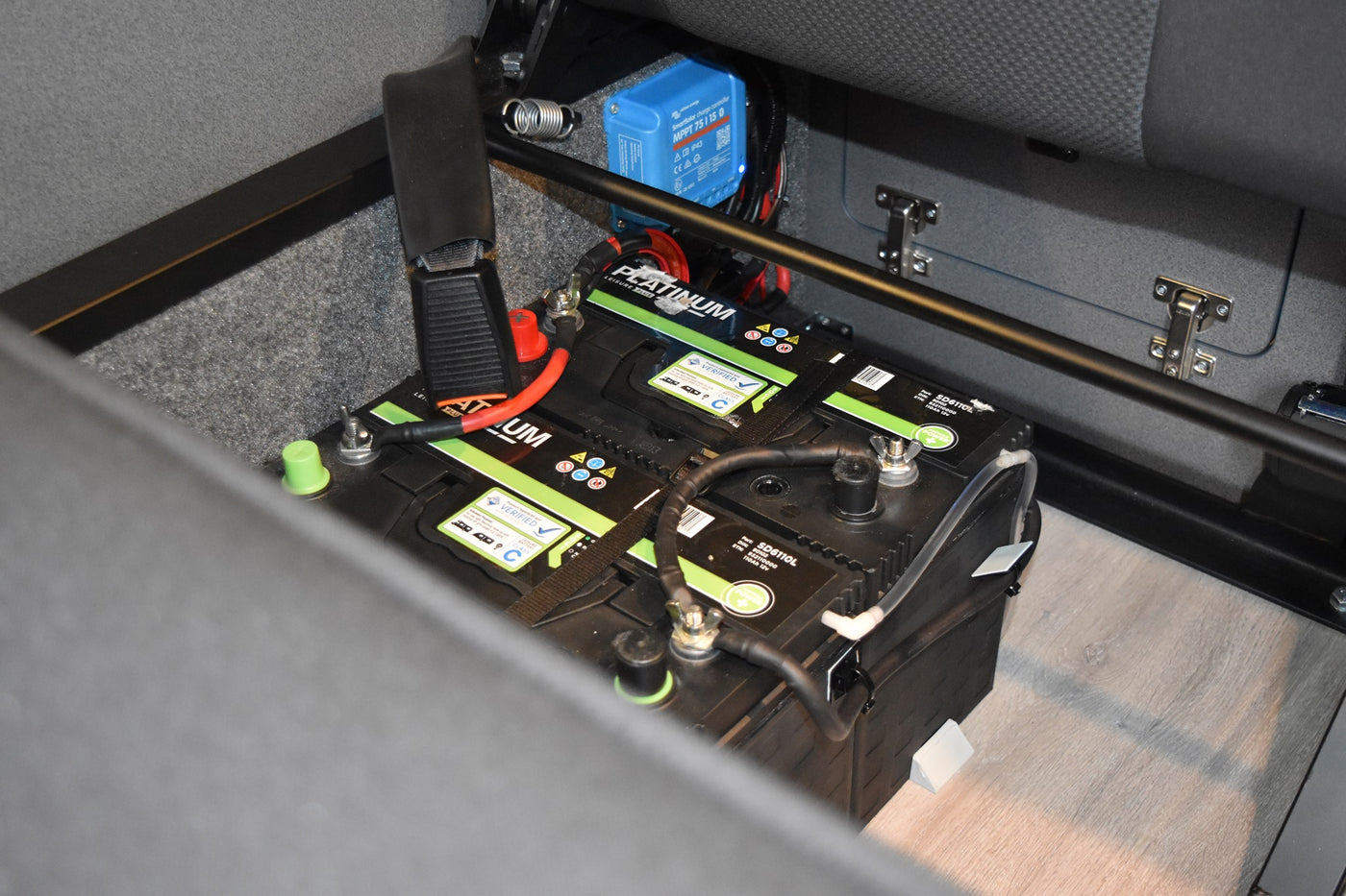 Dual leisure battery system fitted underneath a RIB bed, with a Victron MPPT visible