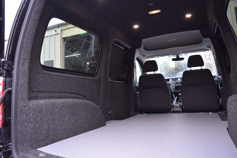 Interior of a Caddy Maxi carpet lined, with ply boarding, LED spot lights and floor covering
