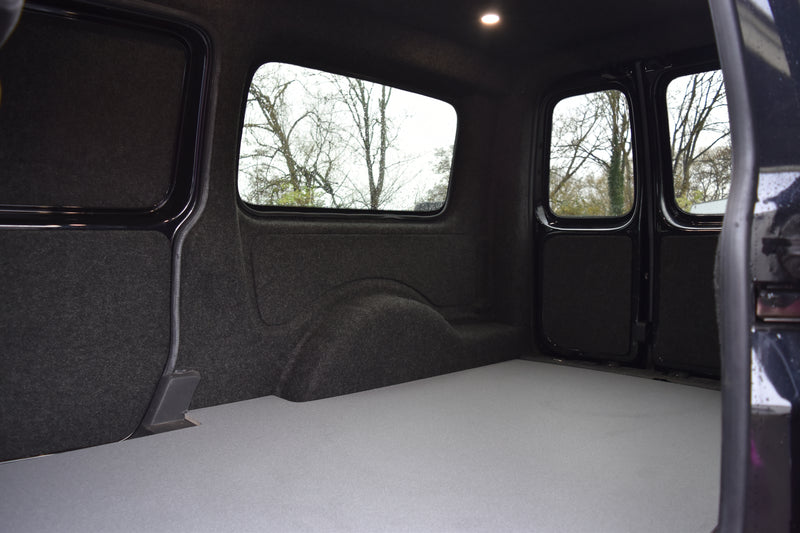 Interior of a Caddy Maxi carpet lined, with ply boarding, LED spot lights and floor covering