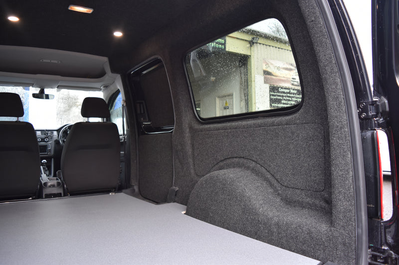 Interior of a Caddy Maxi carpet lined, with ply boarding, LED spot lights and floor covering