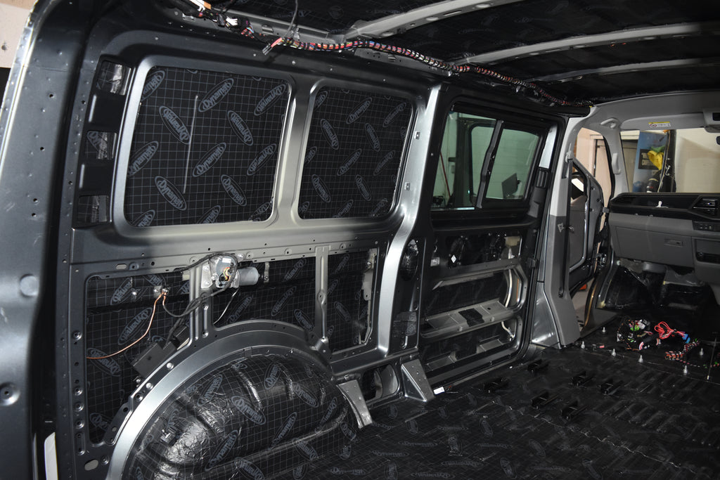 Car interior with soundproofing panels and wiring