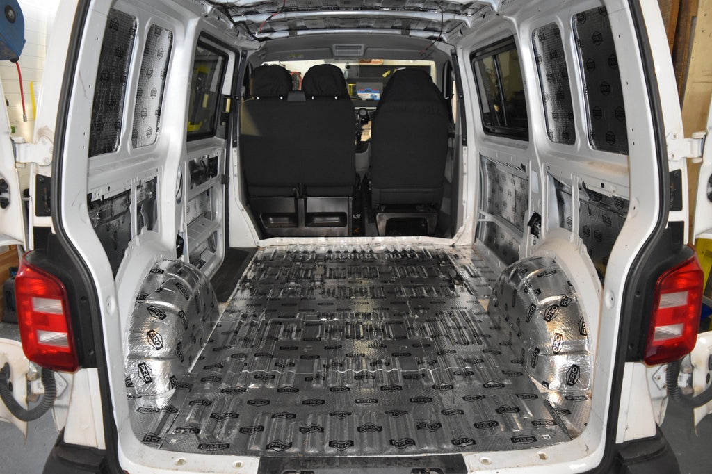 Back of VW Transporter van with sound deadening fitted to the floor, wheel arches, walls and roof
