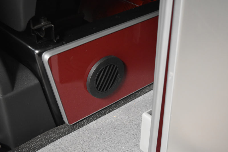 Outlet for diesel heater fitted to red wooden panel