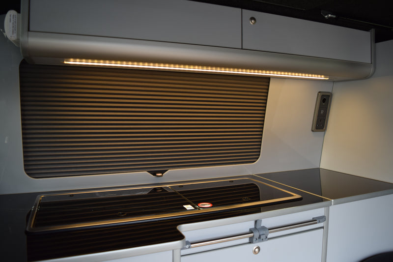 Modern VW Transporter cabinetry with Vanshade blind and acrylic splashback 